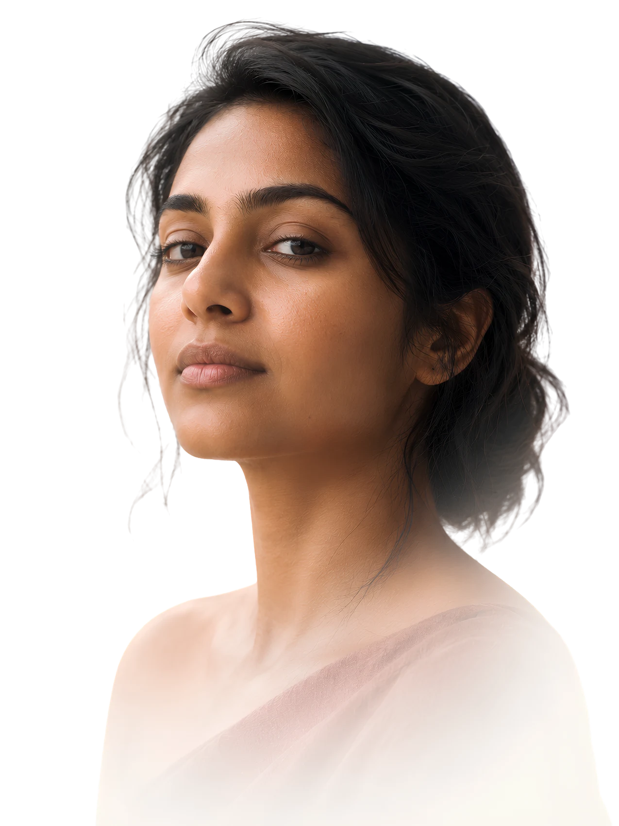 A South Asian woman meeting the viewer's gaze, calm, bare-faced and assured, in soft warm light